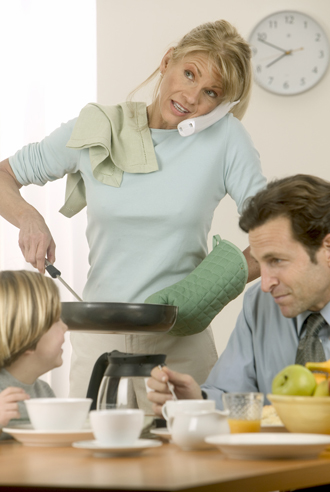 Busy Mother Cooking For Family