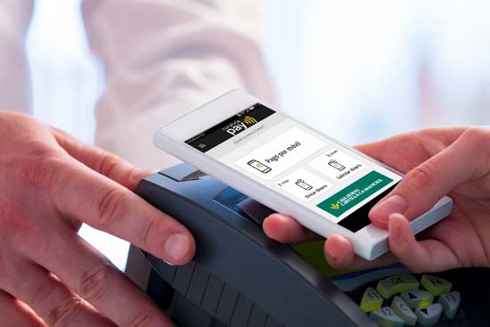 Wireless payment using smartphone and NFC technology. Close up.